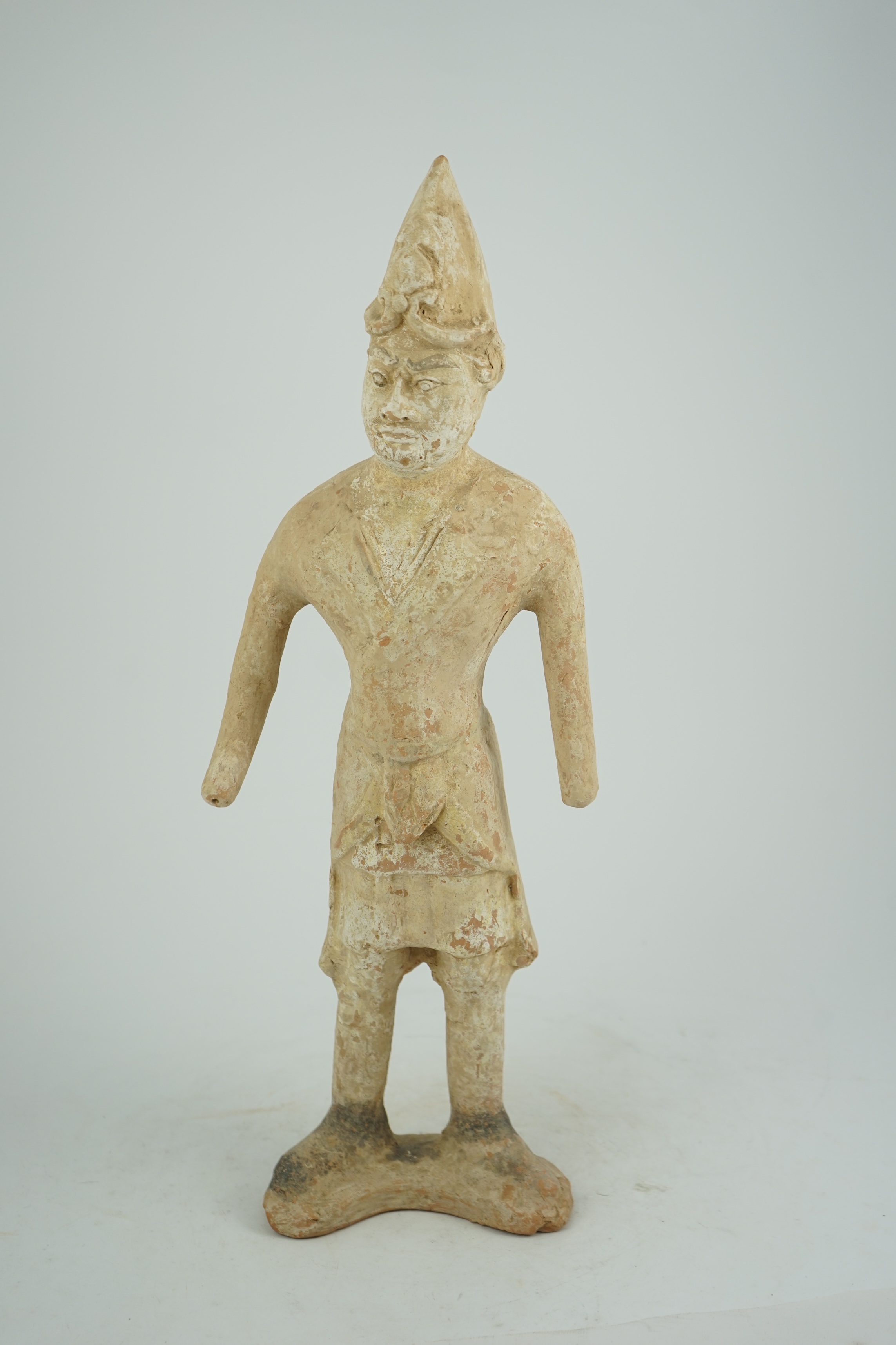 A tall Chinese painted pottery foreigner figure, Tang Dynasty (AD 618-906)